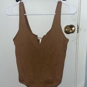Brown stretchy material bodysuit